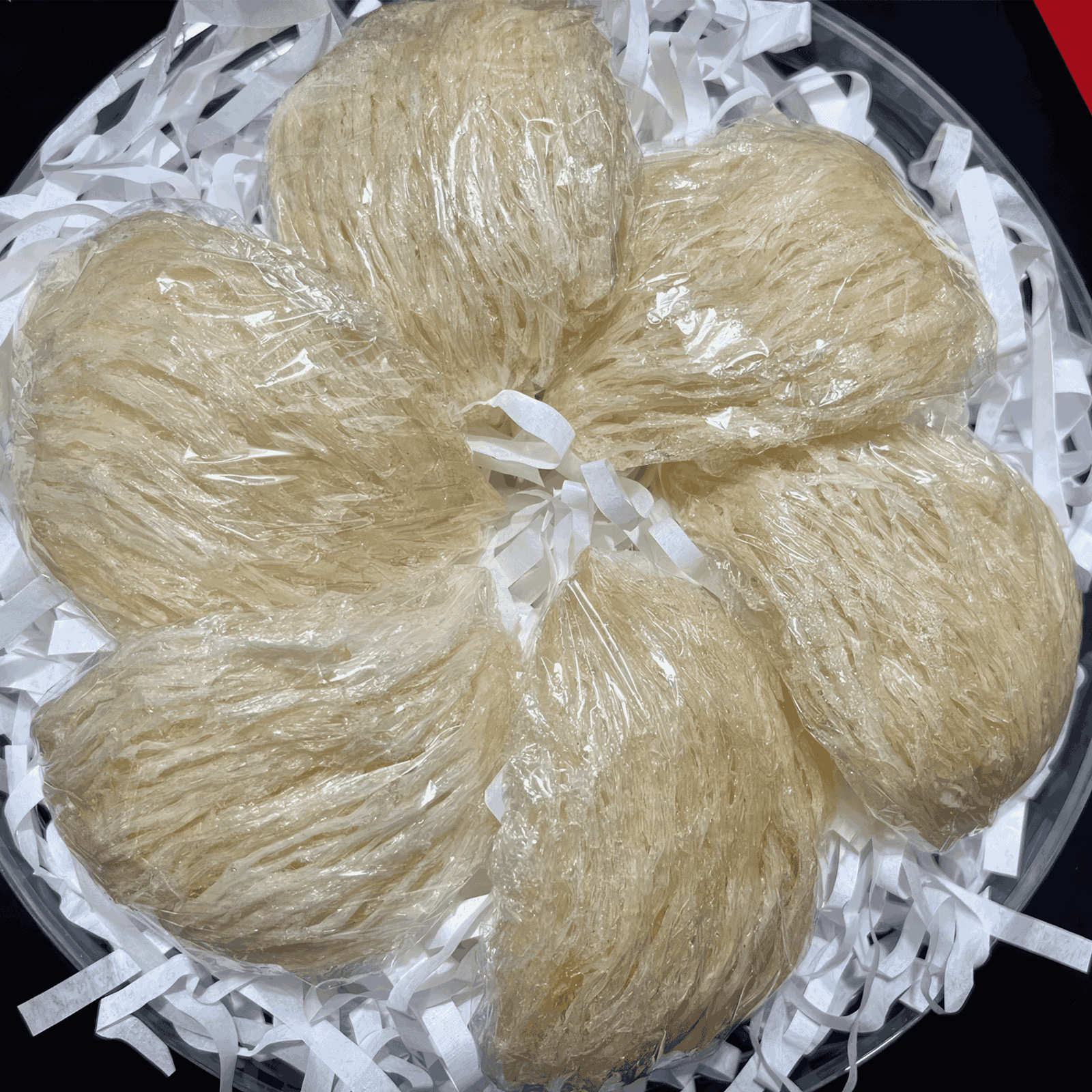 Picture of Yến Tinh Chế laying in bowl on top of white paper