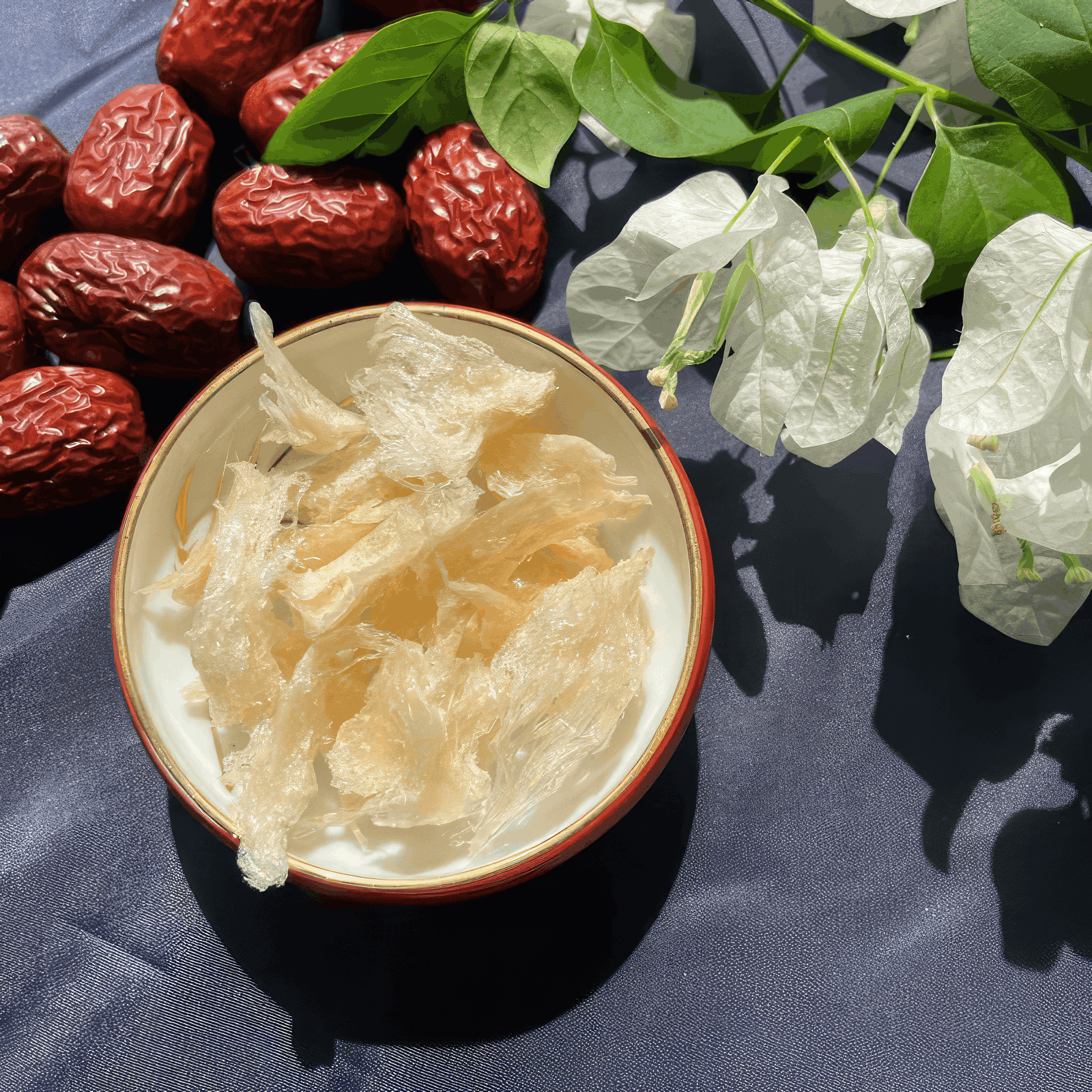 Cleaned bird nest laying in a bowl next to white orchid flowers 